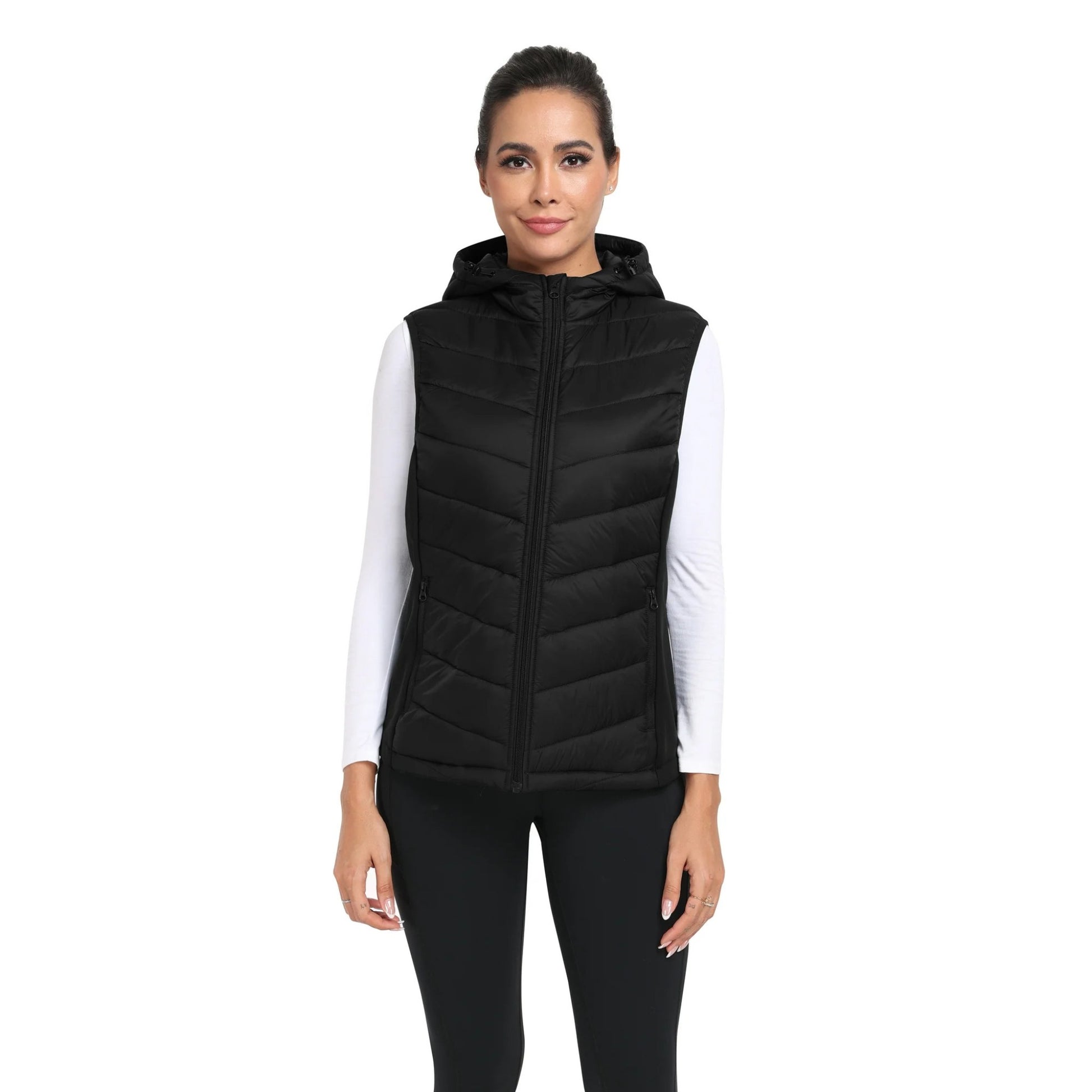 Woman wearing a black puffer vest on a white background