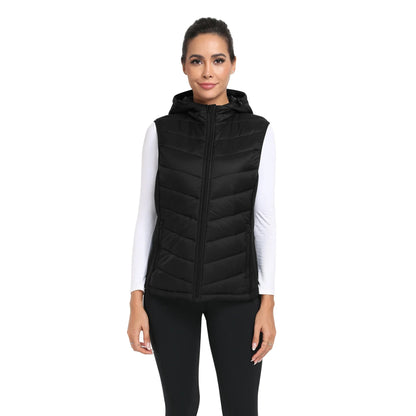 Woman wearing a black puffer vest on a white background