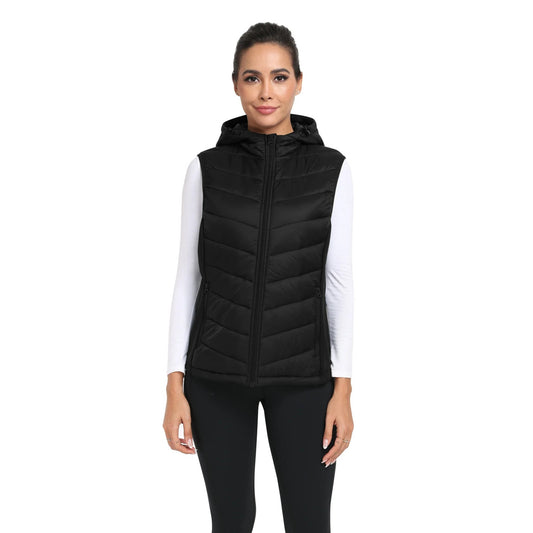 Woman wearing a black puffer vest on a white background